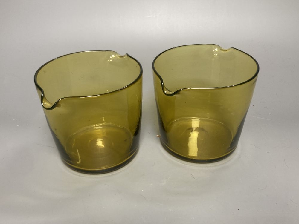 A Bohemian amber flash cut beaker vase, a pair of amber wine glass coolers, 10cm high and a floral painted opaque glass beaker vase, in